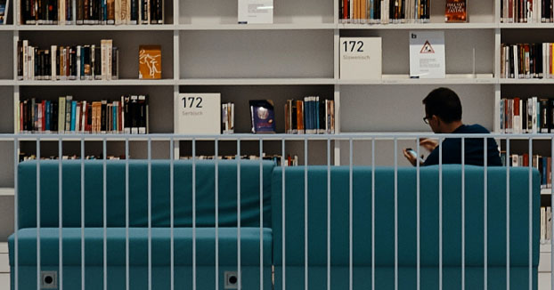 man sitting in library